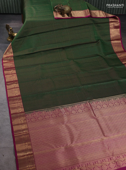 Pure kanchipuram silk saree green and magenta pink with allover zari stripe pattern and rich zari woven border