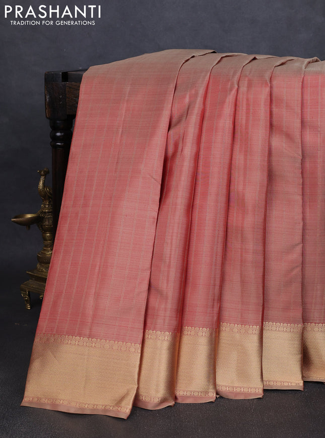 Pure kanchipuram silk saree dual tone rust with allover zari stripe pattern and rich zari woven border