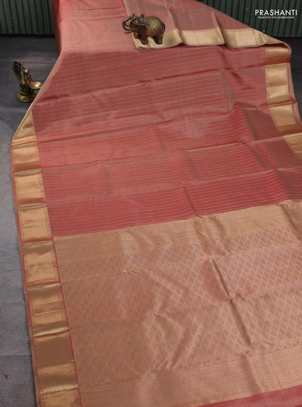Pure kanchipuram silk saree dual tone rust with allover zari stripe pattern and rich zari woven border