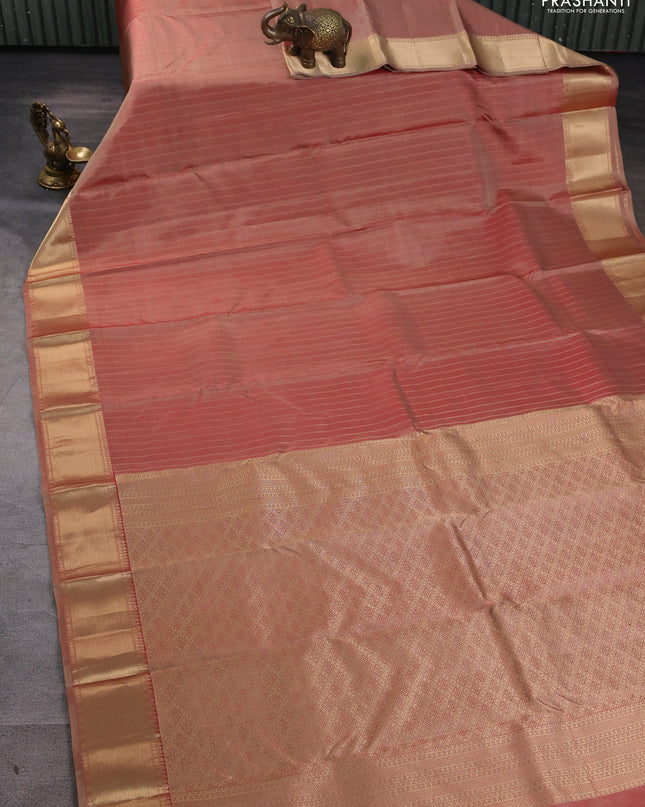Pure kanchipuram silk saree dual tone rust with allover zari stripe pattern and rich zari woven border