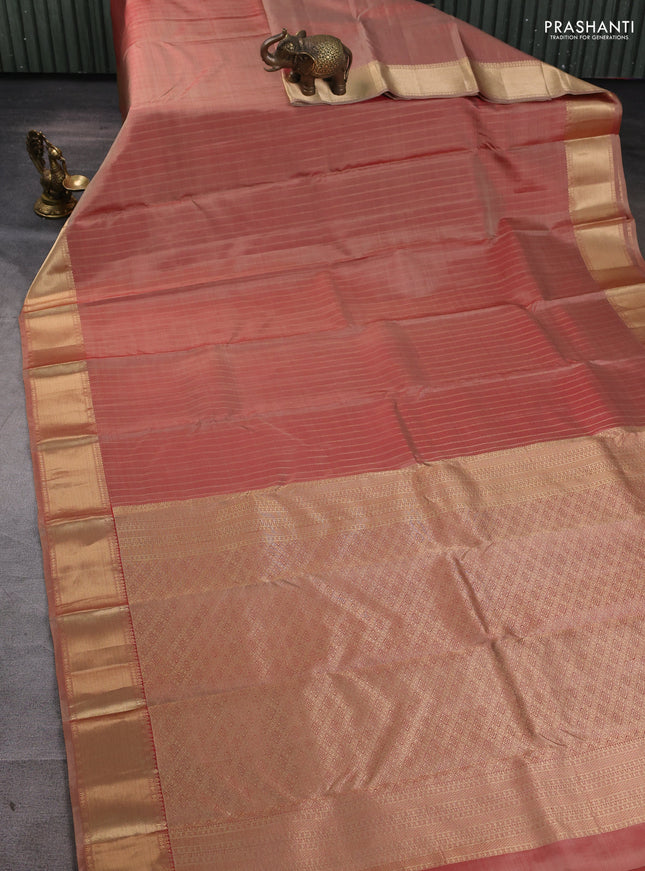 Pure kanchipuram silk saree dual tone rust with allover zari stripe pattern and rich zari woven border