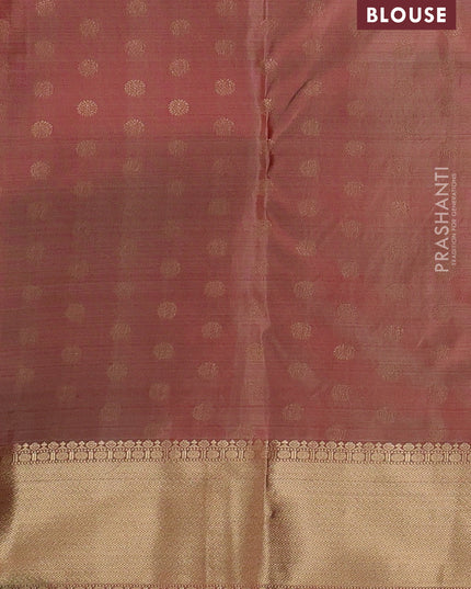 Pure kanchipuram silk saree dual tone rust with allover zari stripe pattern and rich zari woven border