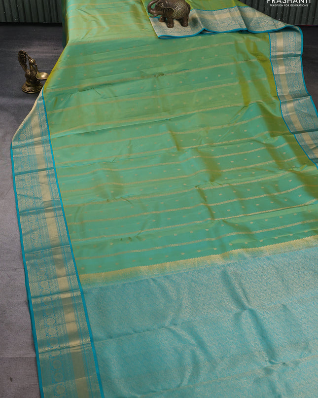 Pure kanchipuram silk saree dual tone green and teal green with allover zari weaves & buttas and rich zari woven border