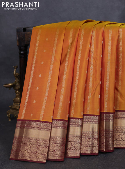Pure kanchipuram silk saree dark mustard and deep maroon with allover zari weaves & buttas and rich zari woven border