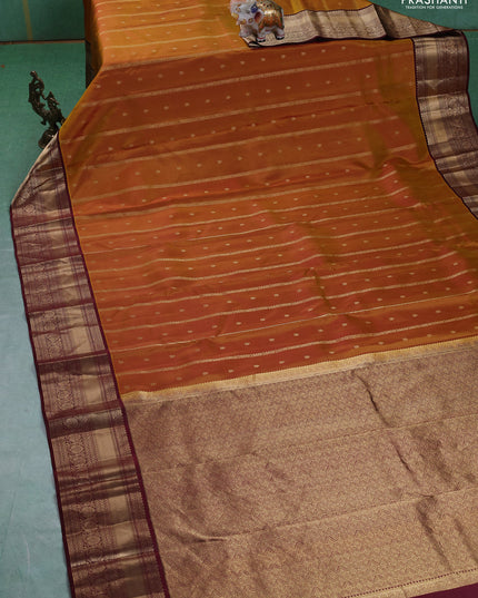 Pure kanchipuram silk saree dark mustard and deep maroon with allover zari weaves & buttas and rich zari woven border