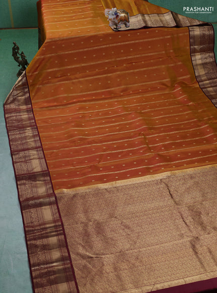 Pure kanchipuram silk saree dark mustard and deep maroon with allover zari weaves & buttas and rich zari woven border