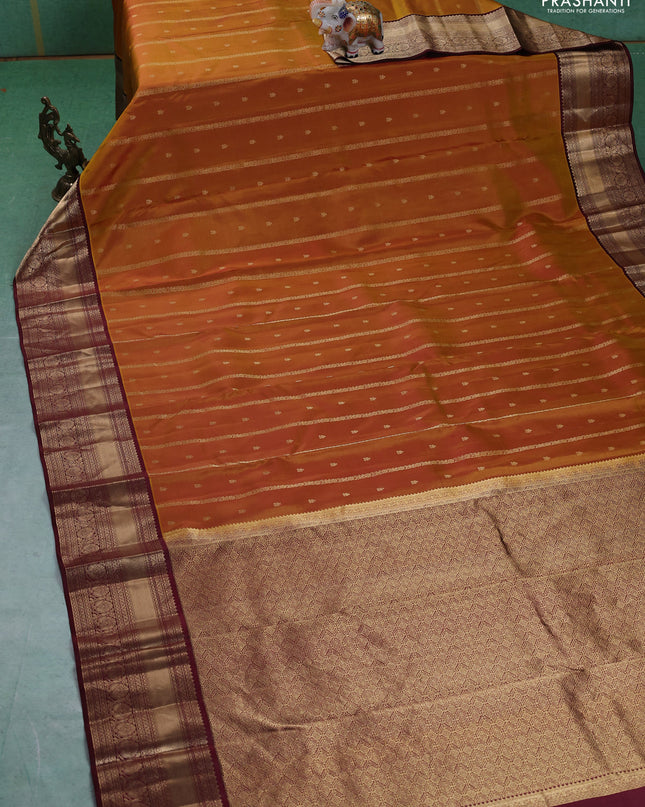 Pure kanchipuram silk saree dark mustard and deep maroon with allover zari weaves & buttas and rich zari woven border