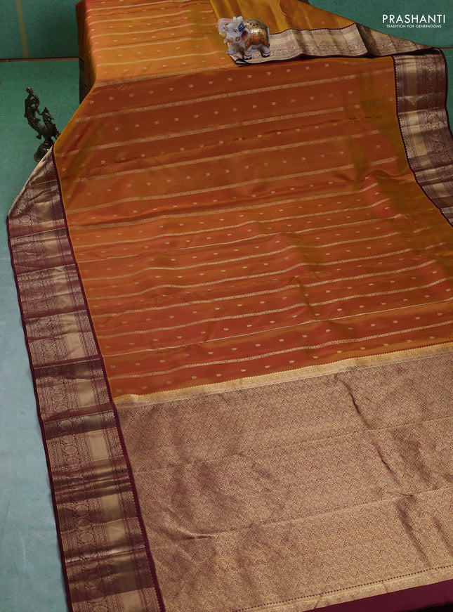 Pure kanchipuram silk saree dark mustard and deep maroon with allover zari weaves & buttas and rich zari woven border