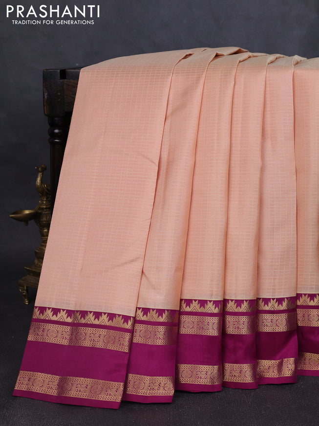 Pure kanchipuram silk saree sandal and dark magenta with allover self emboss pattern and rettapet zari woven border