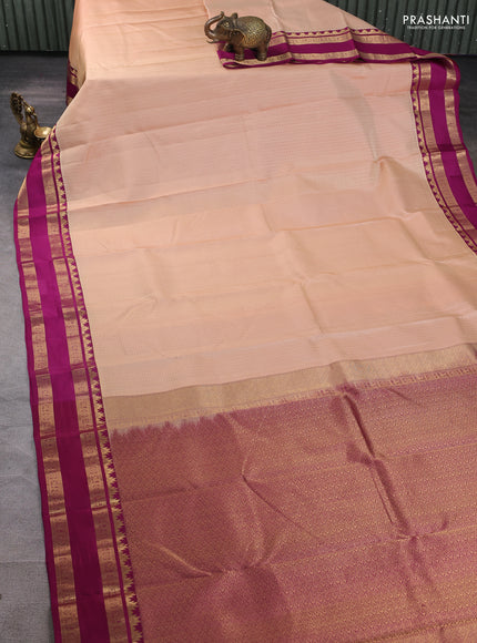 Pure kanchipuram silk saree sandal and dark magenta with allover self emboss pattern and rettapet zari woven border