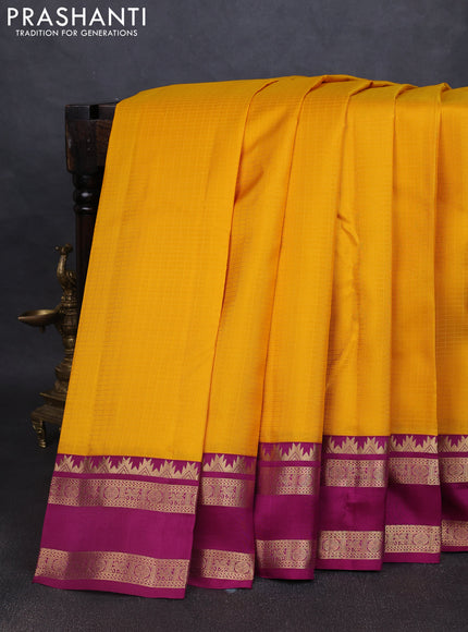 Pure kanchipuram silk saree yellow and dark magenta with allover self emboss pattern and rettapet zari woven border
