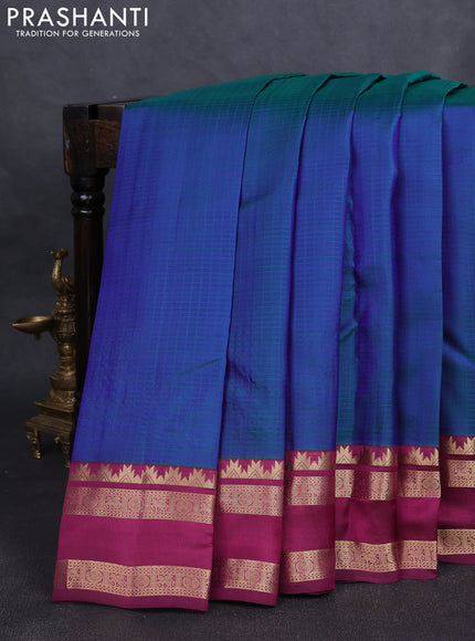 Pure kanchipuram silk saree dual tone bluish green and dark magenta with allover self emboss pattern and rettapet zari woven border