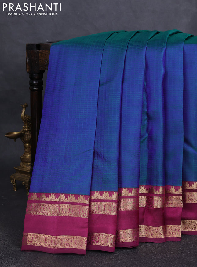 Pure kanchipuram silk saree dual tone bluish green and dark magenta with allover self emboss pattern and rettapet zari woven border