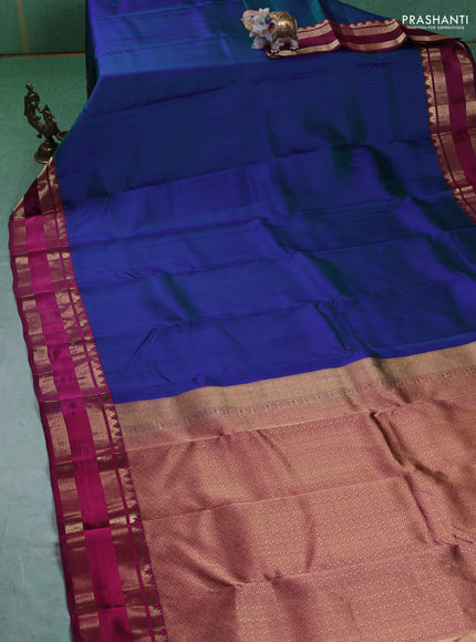Pure kanchipuram silk saree dual tone bluish green and dark magenta with allover self emboss pattern and rettapet zari woven border