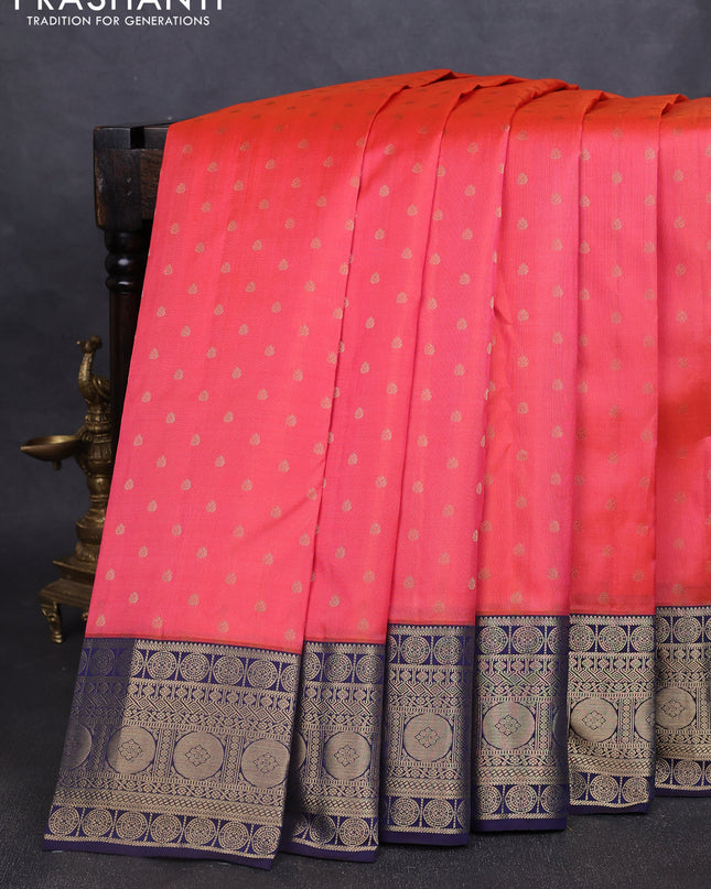 Pure kanchipuram silk saree peach shade and navy blue with allover zari woven 1000 buttas and temple design zari woven border