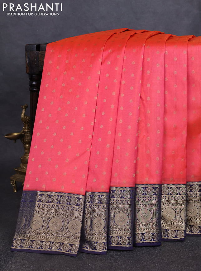 Pure kanchipuram silk saree peach shade and navy blue with allover zari woven 1000 buttas and temple design zari woven border