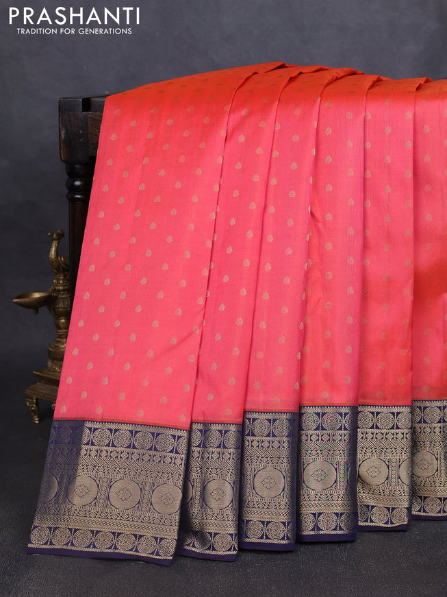 Pure kanchipuram silk saree peach shade and navy blue with allover zari woven 1000 buttas and temple design zari woven border