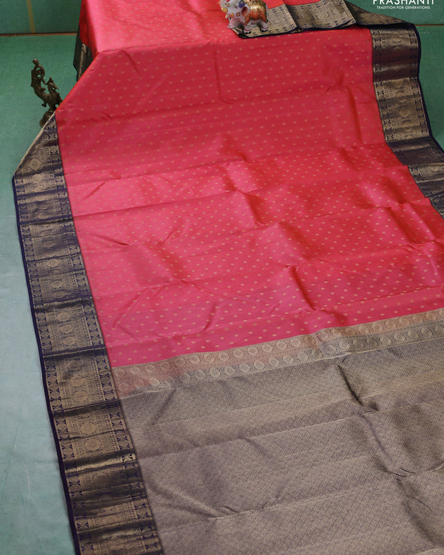 Pure kanchipuram silk saree peach shade and navy blue with allover zari woven 1000 buttas and temple design zari woven border