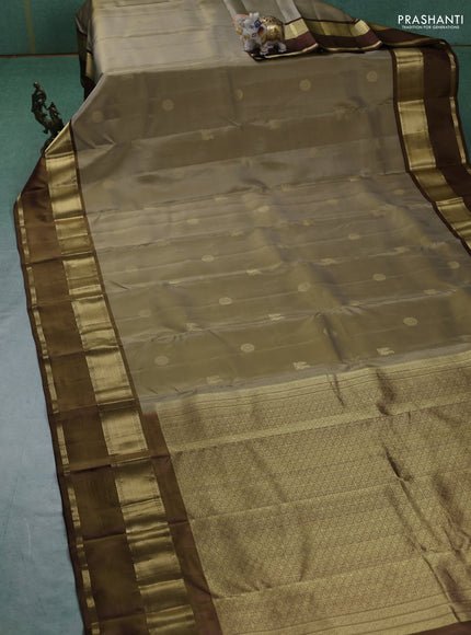 Pure kanchipuram silk saree elaichi green and brown with zari woven buttas and rettapet zari woven border