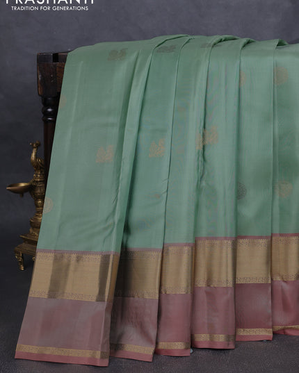 Pure kanchipuram silk saree pastel green and pastel peach with zari woven buttas and rettapet zari woven border