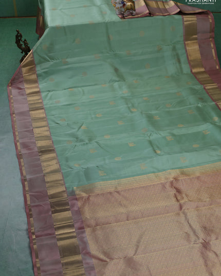 Pure kanchipuram silk saree pastel green and pastel peach with zari woven buttas and rettapet zari woven border