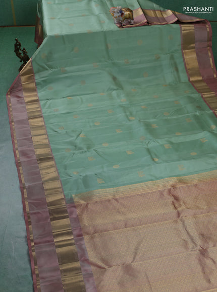 Pure kanchipuram silk saree pastel green and pastel peach with zari woven buttas and rettapet zari woven border