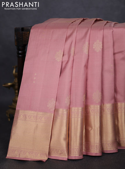 Pure kanchipuram silk saree pastel peach and bottle green with allover vairaosi pattern & zari buttas and long rich zari woven border