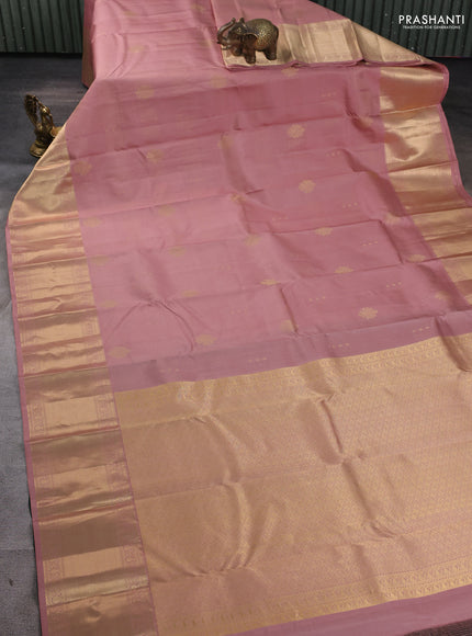Pure kanchipuram silk saree pastel peach and bottle green with allover vairaosi pattern & zari buttas and long rich zari woven border