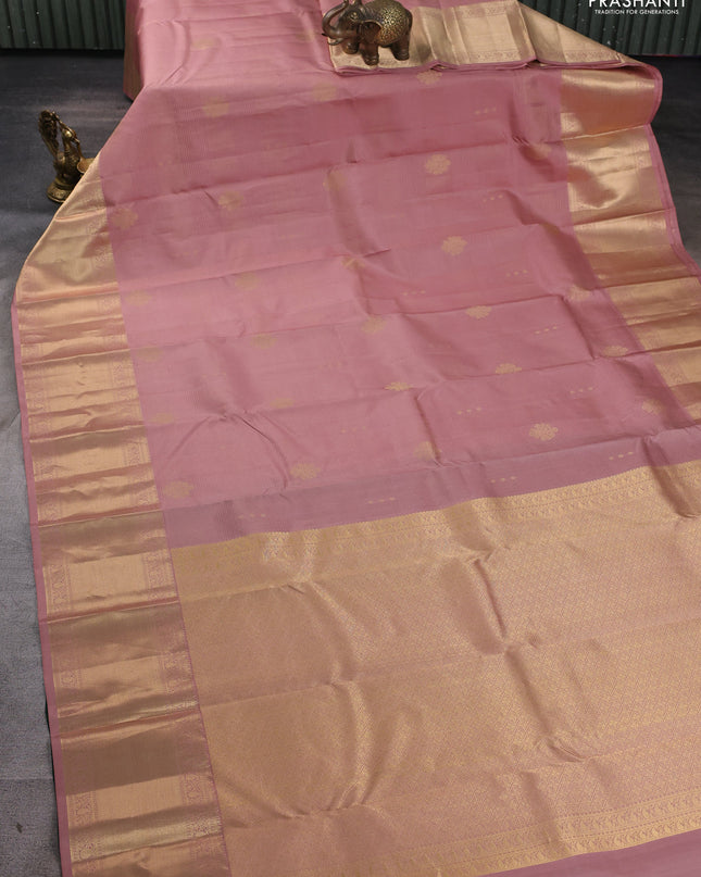 Pure kanchipuram silk saree pastel peach and bottle green with allover vairaosi pattern & zari buttas and long rich zari woven border
