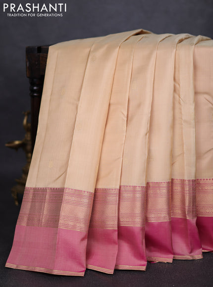 Pure kanchipuram silk saree cream and dual tone pink with zari woven buttas and ganga jamuna border