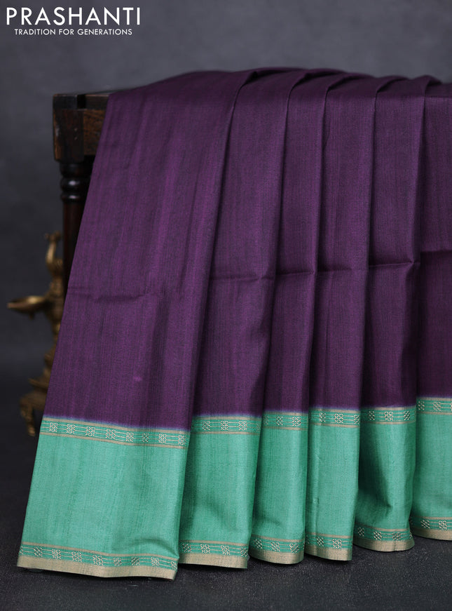 Art tussar saree deep jamun and teal green with plain body and rettapet zari woven border