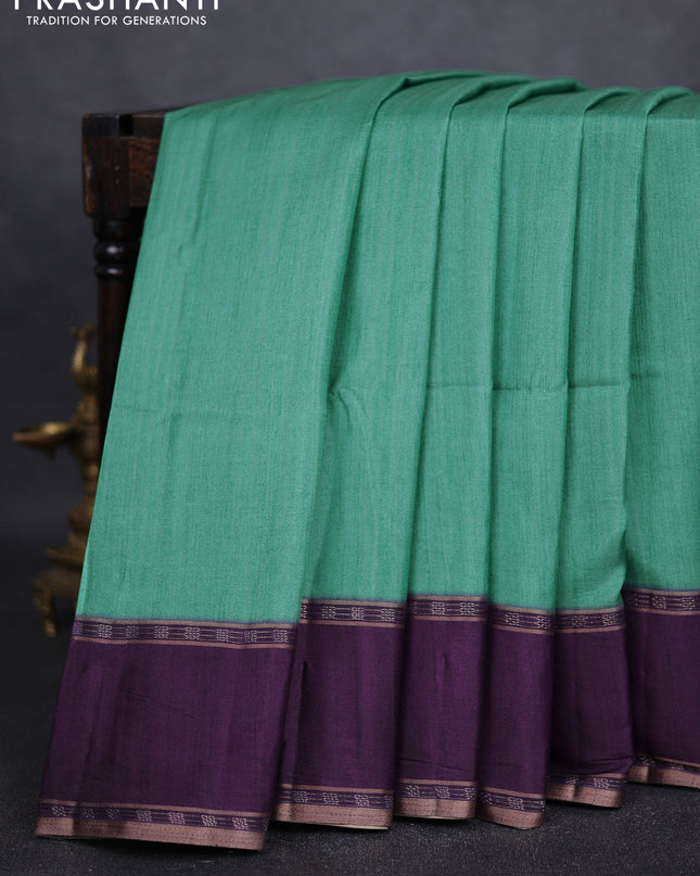 Art tussar saree teal green and deep purple with plain body and rettapet zari woven border