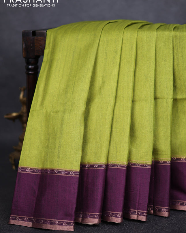 Art tussar saree light green and deep purple with plain body and rettapet zari woven border