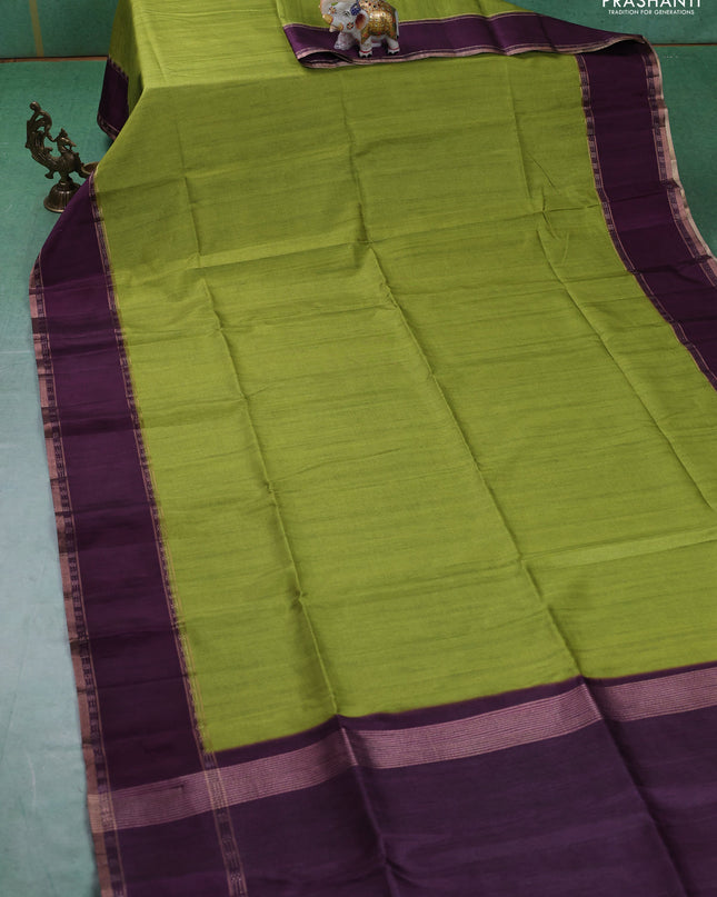 Art tussar saree light green and deep purple with plain body and rettapet zari woven border