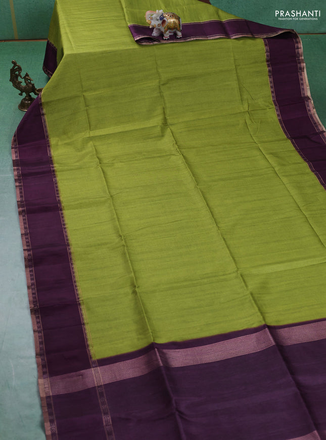 Art tussar saree light green and deep purple with plain body and rettapet zari woven border