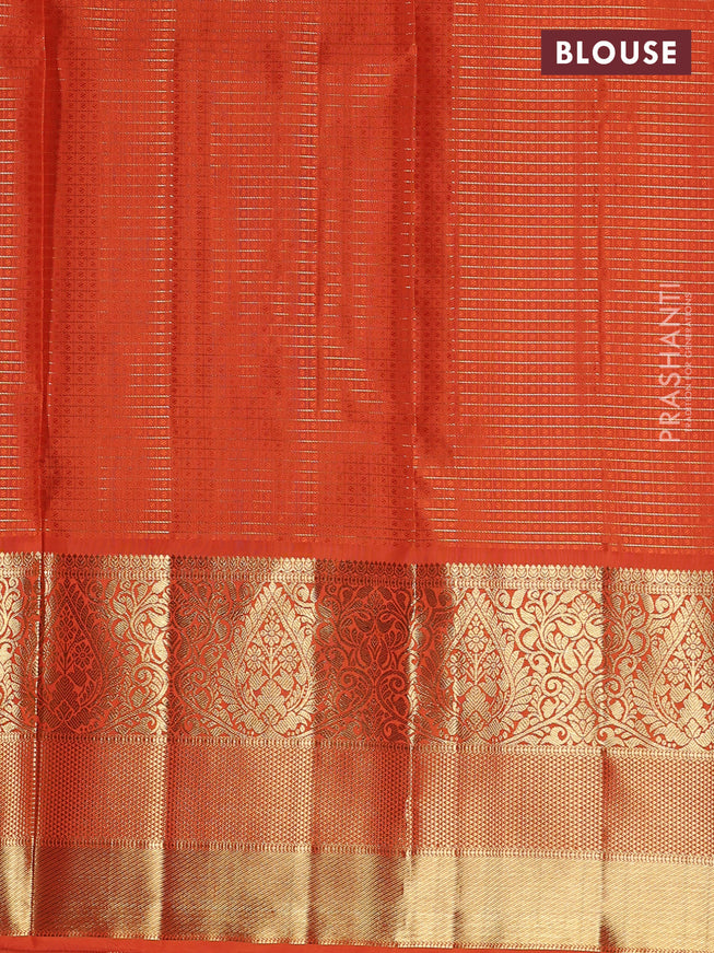 Pure kanchipuram unstitched silk  lehenga purple and orange with allover zari checks & buttas and long zari woven border