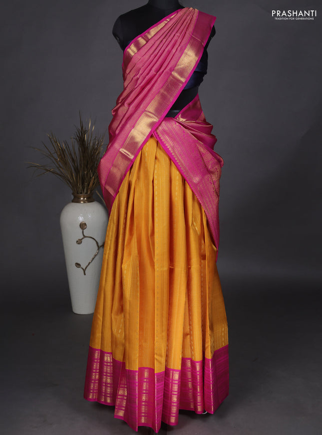 Pure kanchipuram unstitched silk lehenga mustard yellow and pink with allover zari weaves and zari woven border