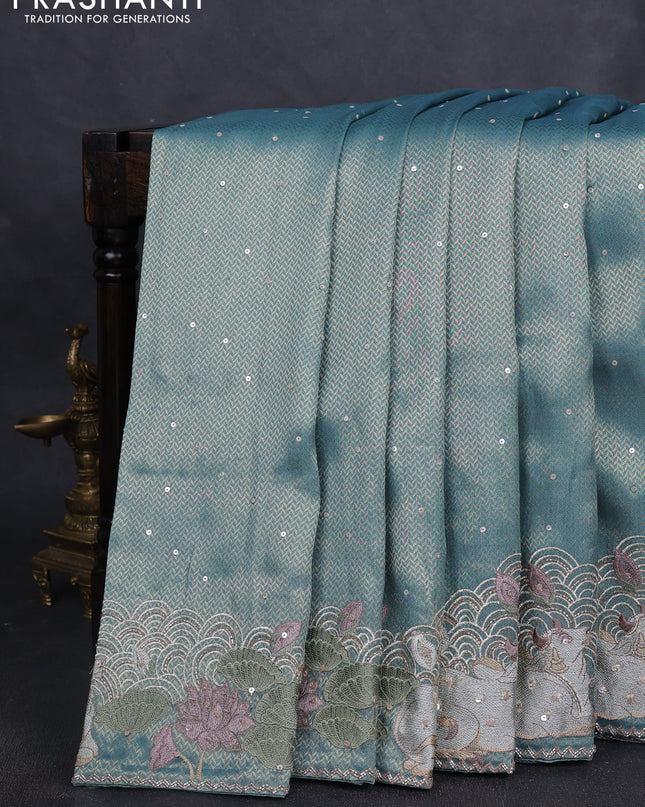 Banarasi silk saree teal blue shade with allover zari weaves & sequin work and embroidery border