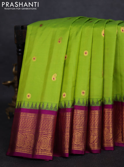 Pure gadwal silk saree light green and purple with zari woven paisley buttas and temple design zari woven border