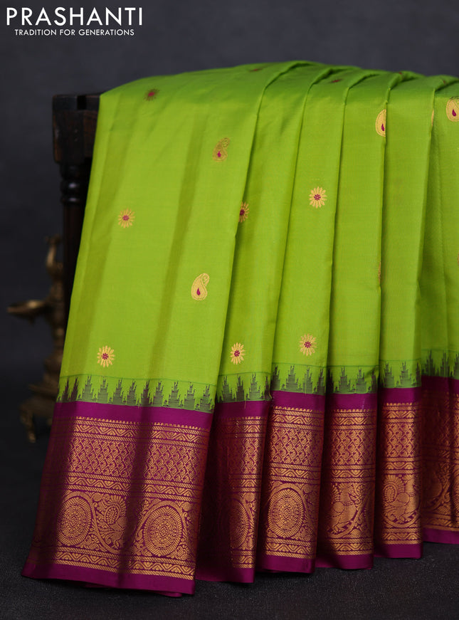 Pure gadwal silk saree light green and purple with zari woven paisley buttas and temple design zari woven border