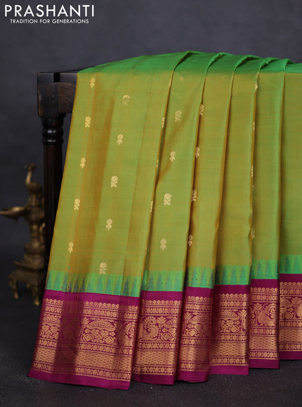 Pure gadwal silk saree dual shade of light green and purple with zari woven buttas and temple design zari woven border