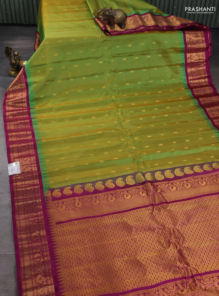 Pure gadwal silk saree dual shade of light green and purple with zari woven buttas and temple design zari woven border