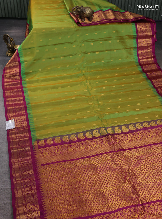 Pure gadwal silk saree dual shade of light green and purple with zari woven buttas and temple design zari woven border