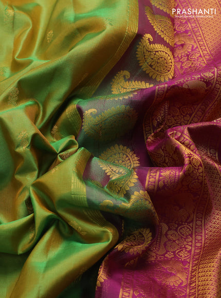 Pure gadwal silk saree dual shade of light green and purple with zari woven buttas and temple design zari woven border