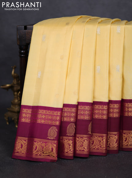 Pure gadwal silk saree pale yellow and purple with silver zari woven buttas and rettapet zari woven border