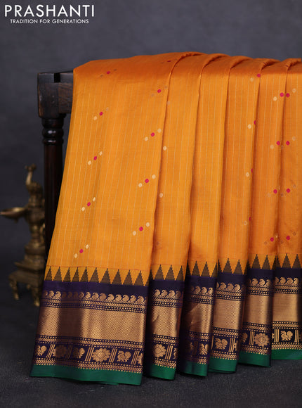 Pure gadwal silk saree mustard yellow and navy blue with allover zari weaves & buttas and zari woven border