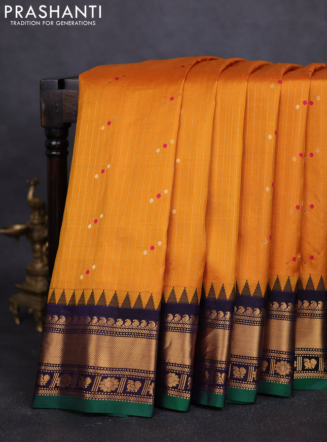 Pure gadwal silk saree mustard yellow and navy blue with allover zari weaves & buttas and zari woven border
