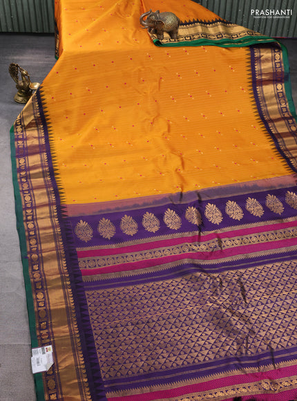 Pure gadwal silk saree mustard yellow and navy blue with allover zari weaves & buttas and zari woven border