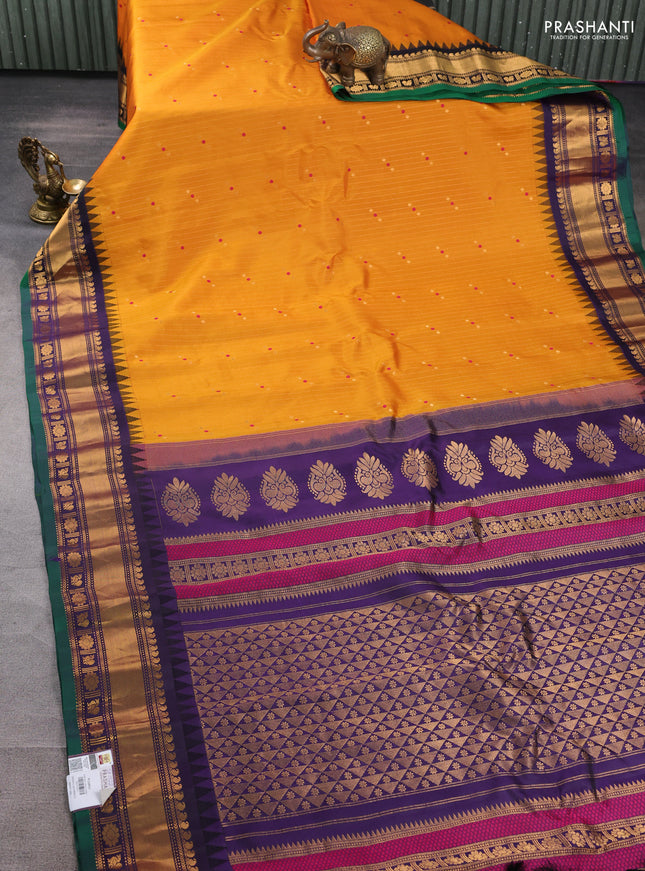 Pure gadwal silk saree mustard yellow and navy blue with allover zari weaves & buttas and zari woven border