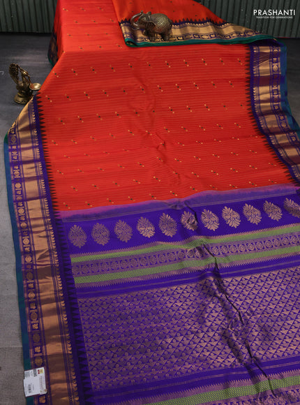 Pure gadwal silk saree orange and blue with allover zari weaves & buttas and zari woven border